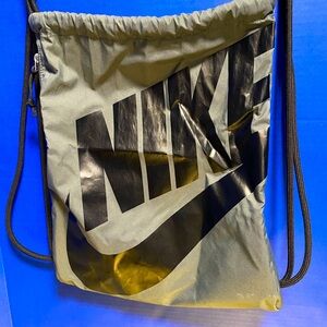 Nike Gray Drawstring Backpack w/Black Nike Lettering Zipper side pocket 16”x12”